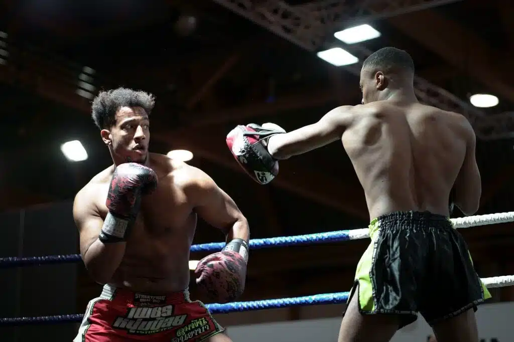 Two fighters training in a boxing ring