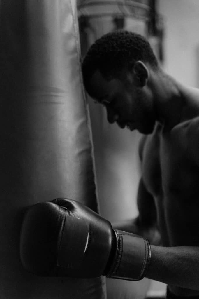 A tired boxer who has run out of energy
