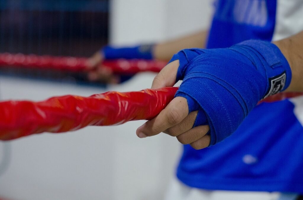 boxer standing on the ring ropes