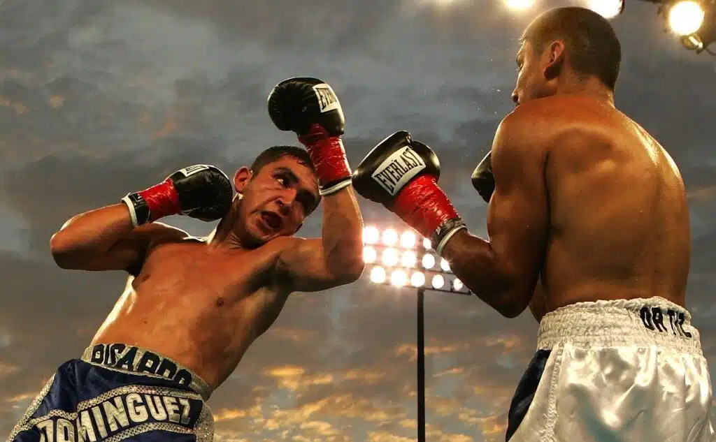 A boxer throwing a lead uppercut at an opponent