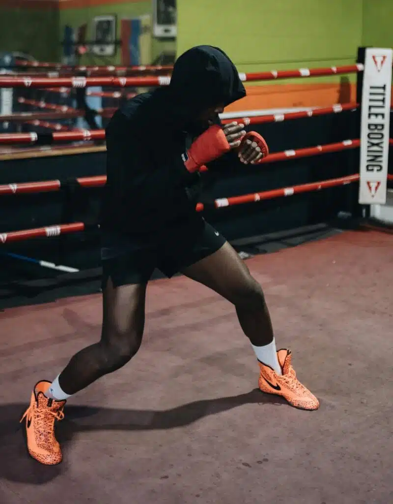 Boxer practising his stance in the boxing ring