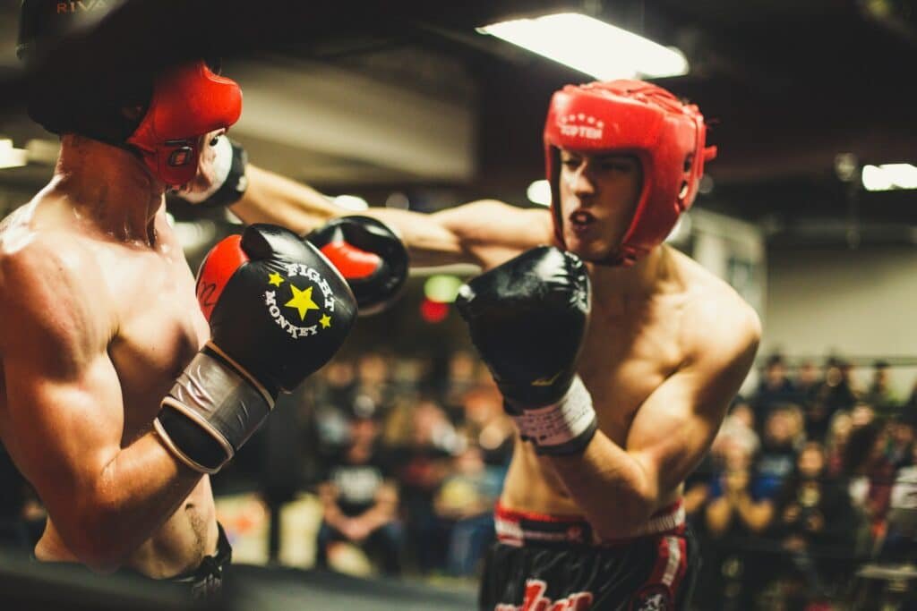 Boxer lands a successful cross on an opponent