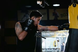 A boxer learning how to throw a proper jab