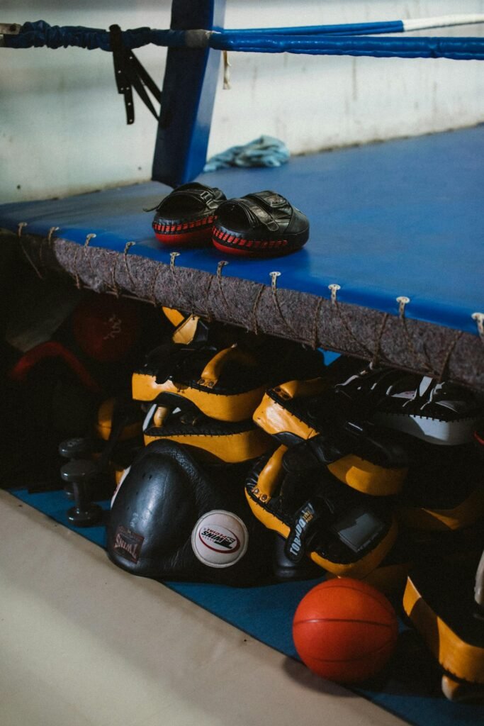 Selection of boxing equipment like pads and belts
