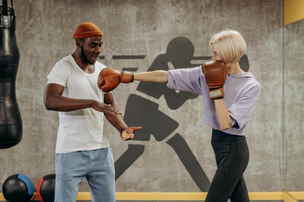 A coach showing how to throw a jab in boxing