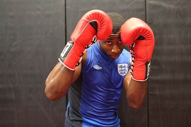 Boxer in default stance with modern day boxing gloves