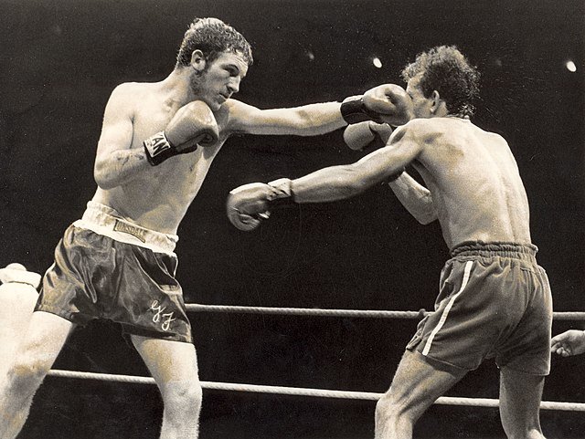 Old school boxers fighting in a boxing ring