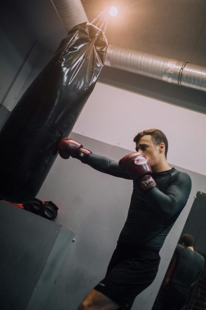 A boxer landing a jab on the heavy bag