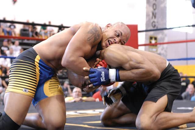MMA fighters grappling on the ground in an MMA fight