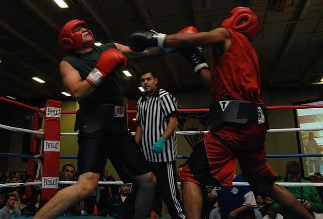 Boxers sparring in a boxing ring