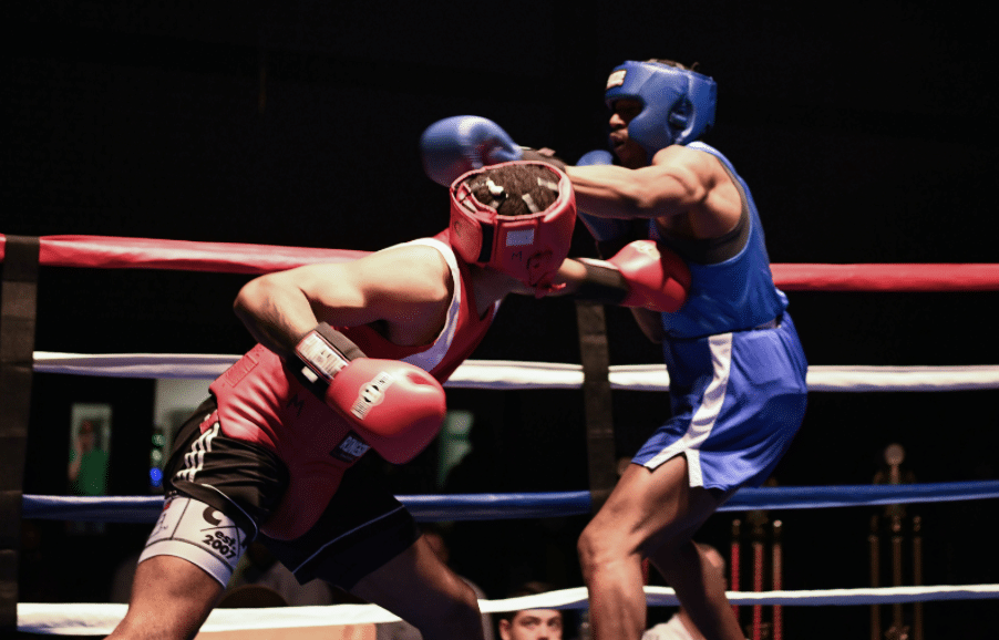 a boxer slipping a punch and countering in a boxing gym