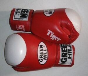 A pair of beginner boxing gloves on a table