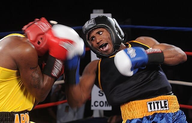 boxer blocking an uppercut punch in a boxing match