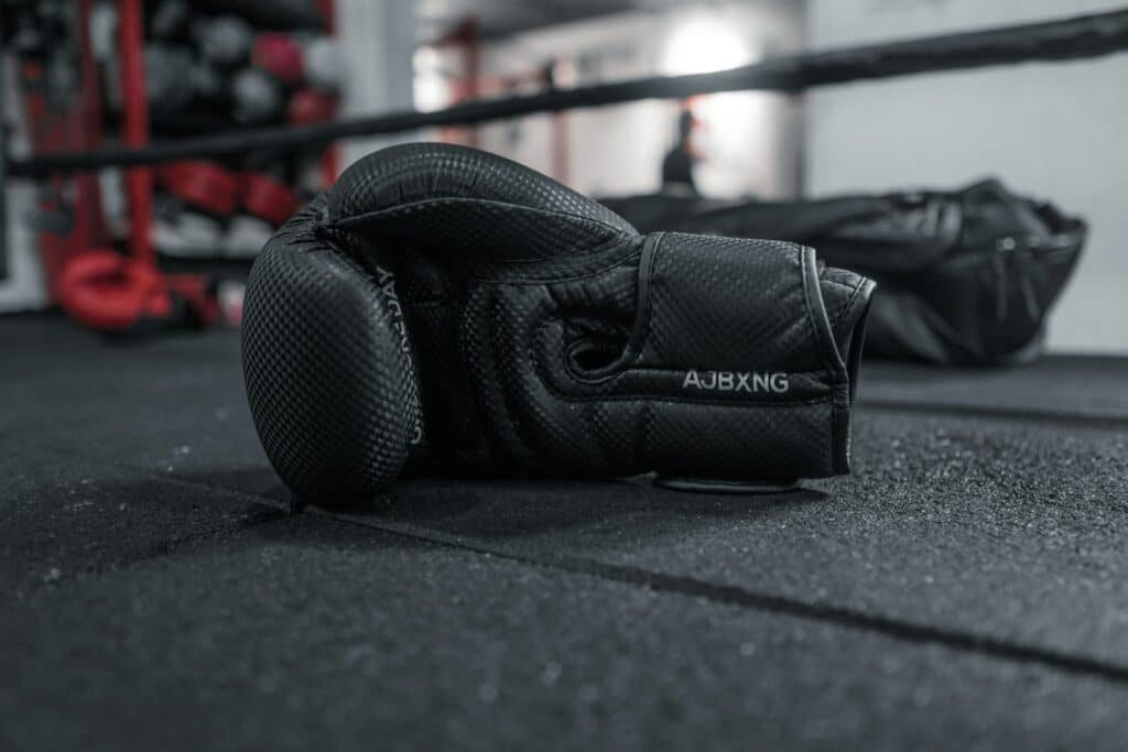 pair of gloves on the floor of a boxing ring