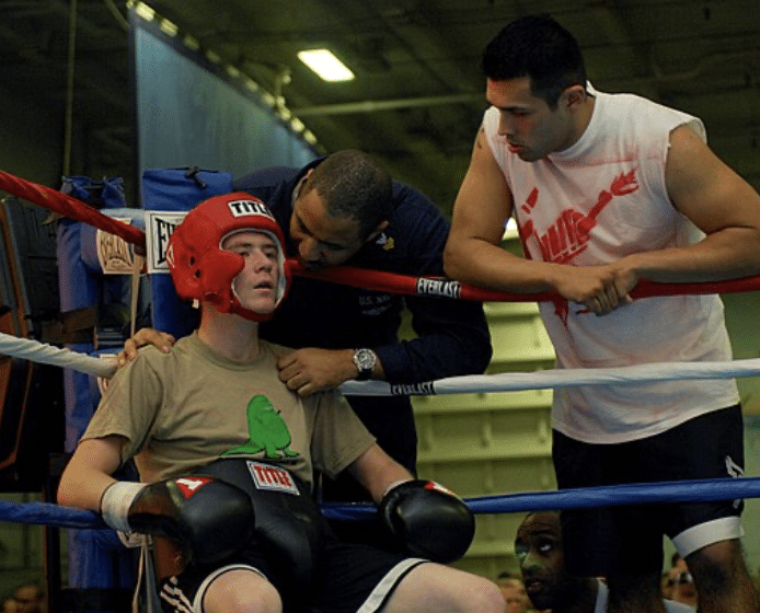 A boxer breathing properly during his break in the corner during a boxing match