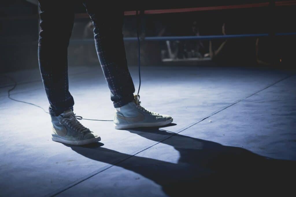 A man wearing normal trainers in a ring